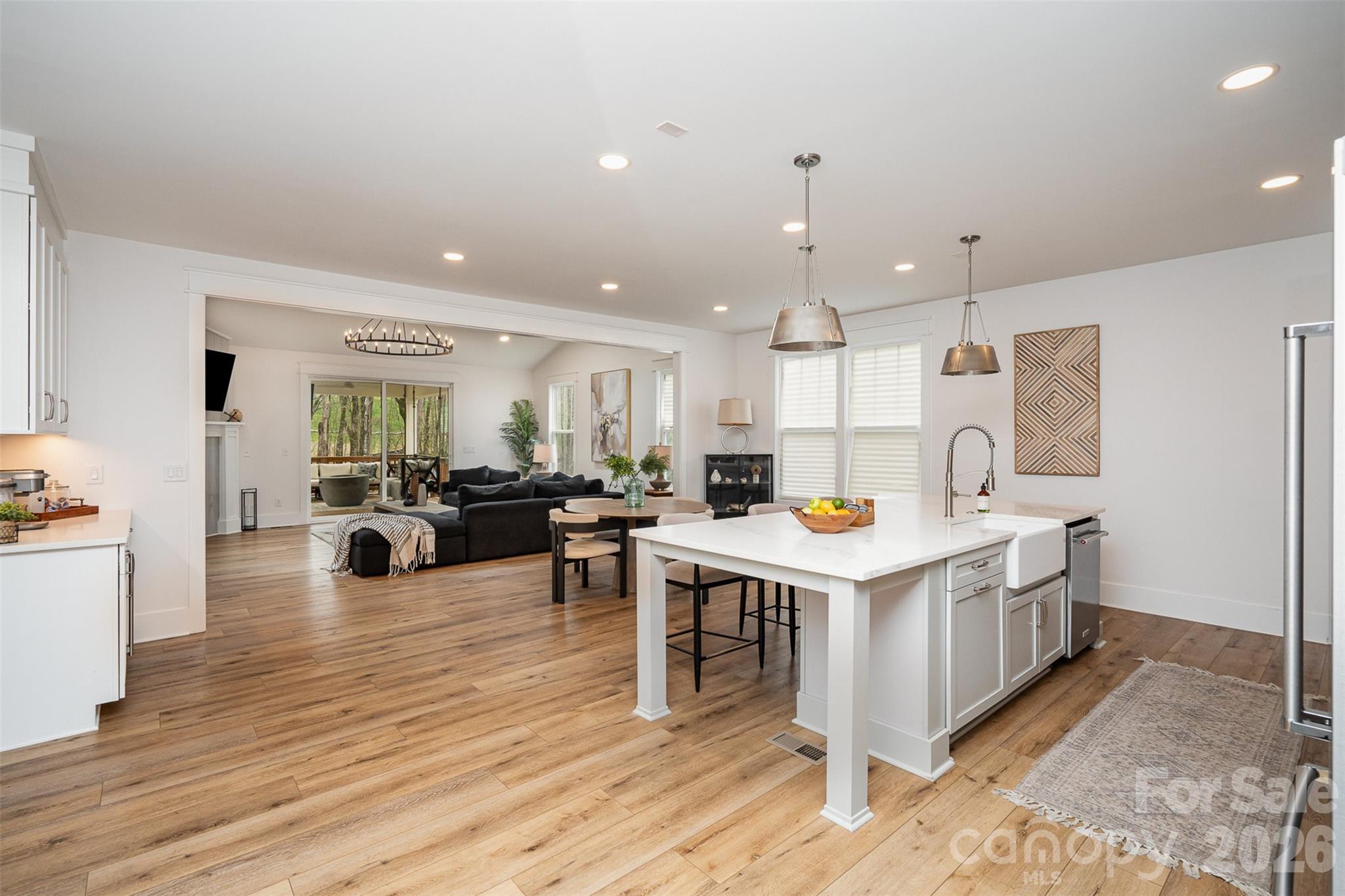 4125 Spring Street Charlotte, NC 28270 - Photo 12 of 37 a kitchen view with stainless steel appliances kitchen island a stove and a refrigerator