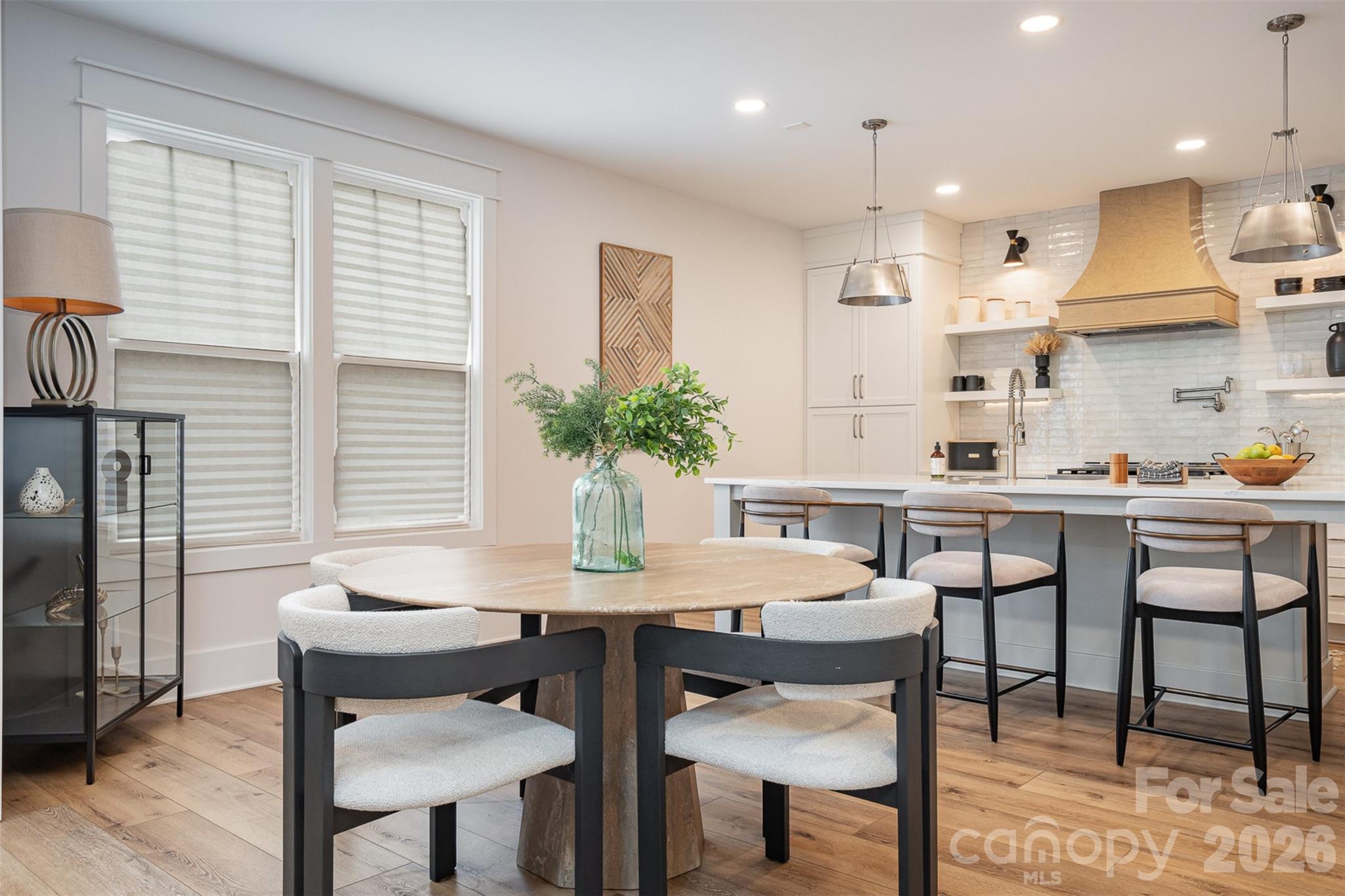 4125 Spring Street Charlotte, NC 28270 - Photo 14 of 37 a kitchen with a table and chairs in it