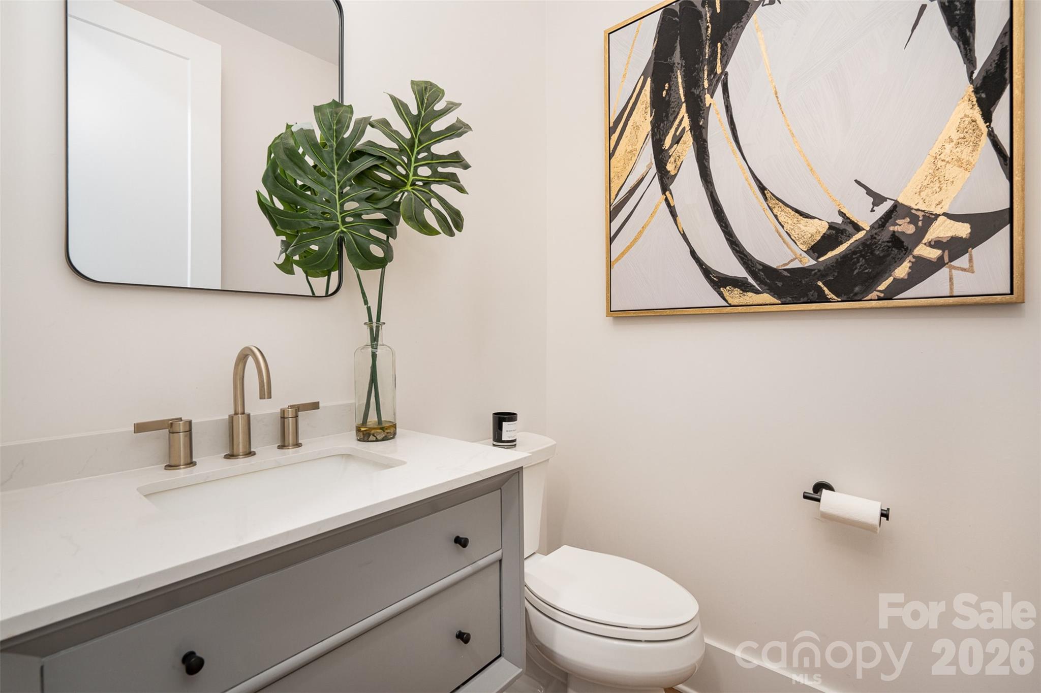 4125 Spring Street Charlotte, NC 28270 - Photo 16 of 37 a bathroom with a toilet sink and mirror