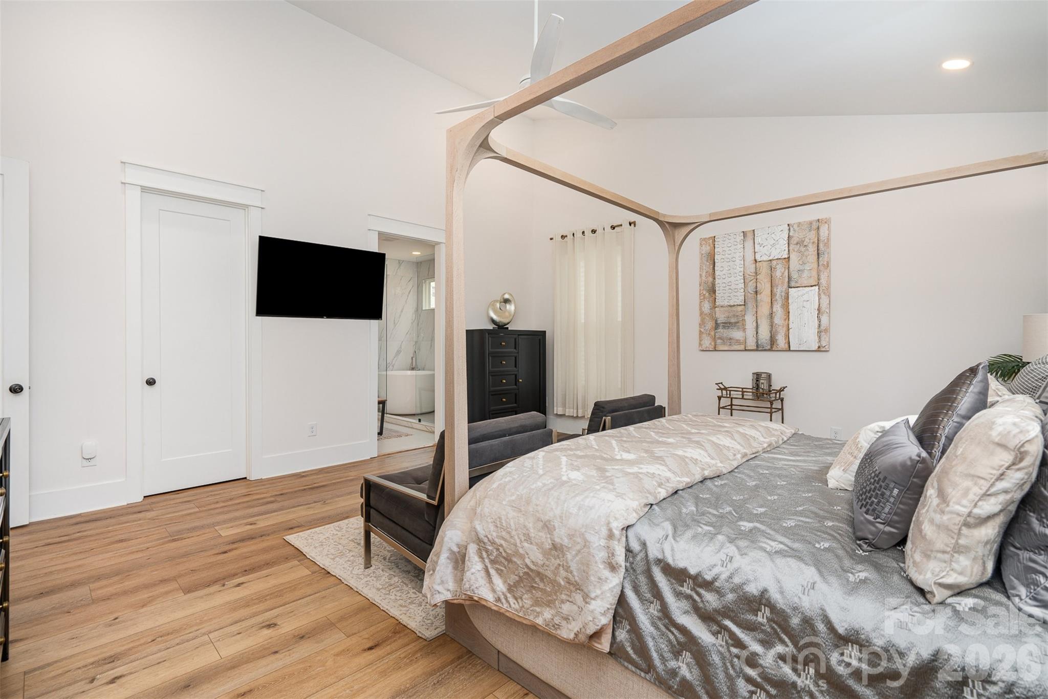 4125 Spring Street Charlotte, NC 28270 - Photo 18 of 37 a bedroom with a bed and a flat screen tv