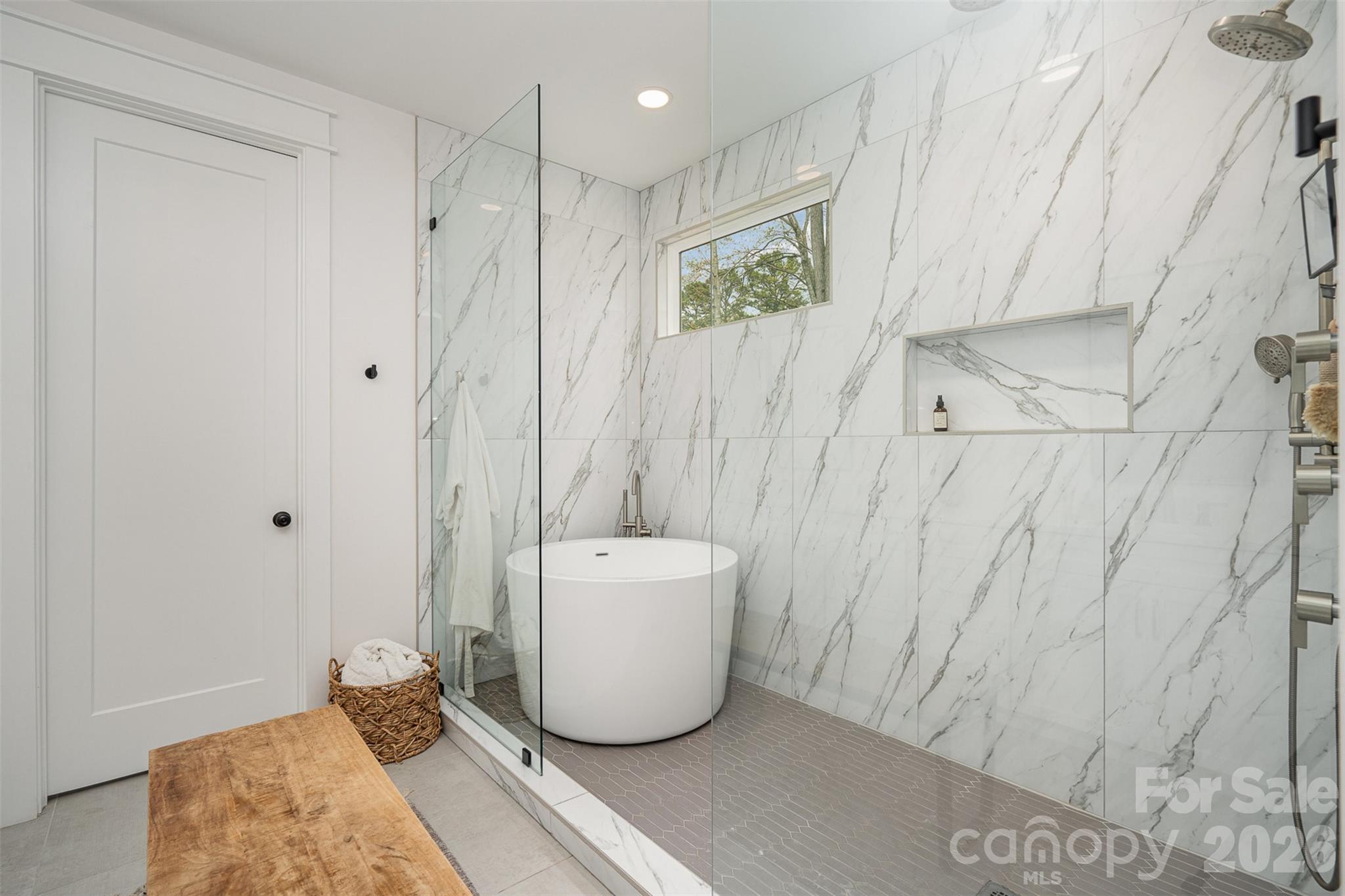 4125 Spring Street Charlotte, NC 28270 - Photo 21 of 37 a bathroom with a bathtub and shower
