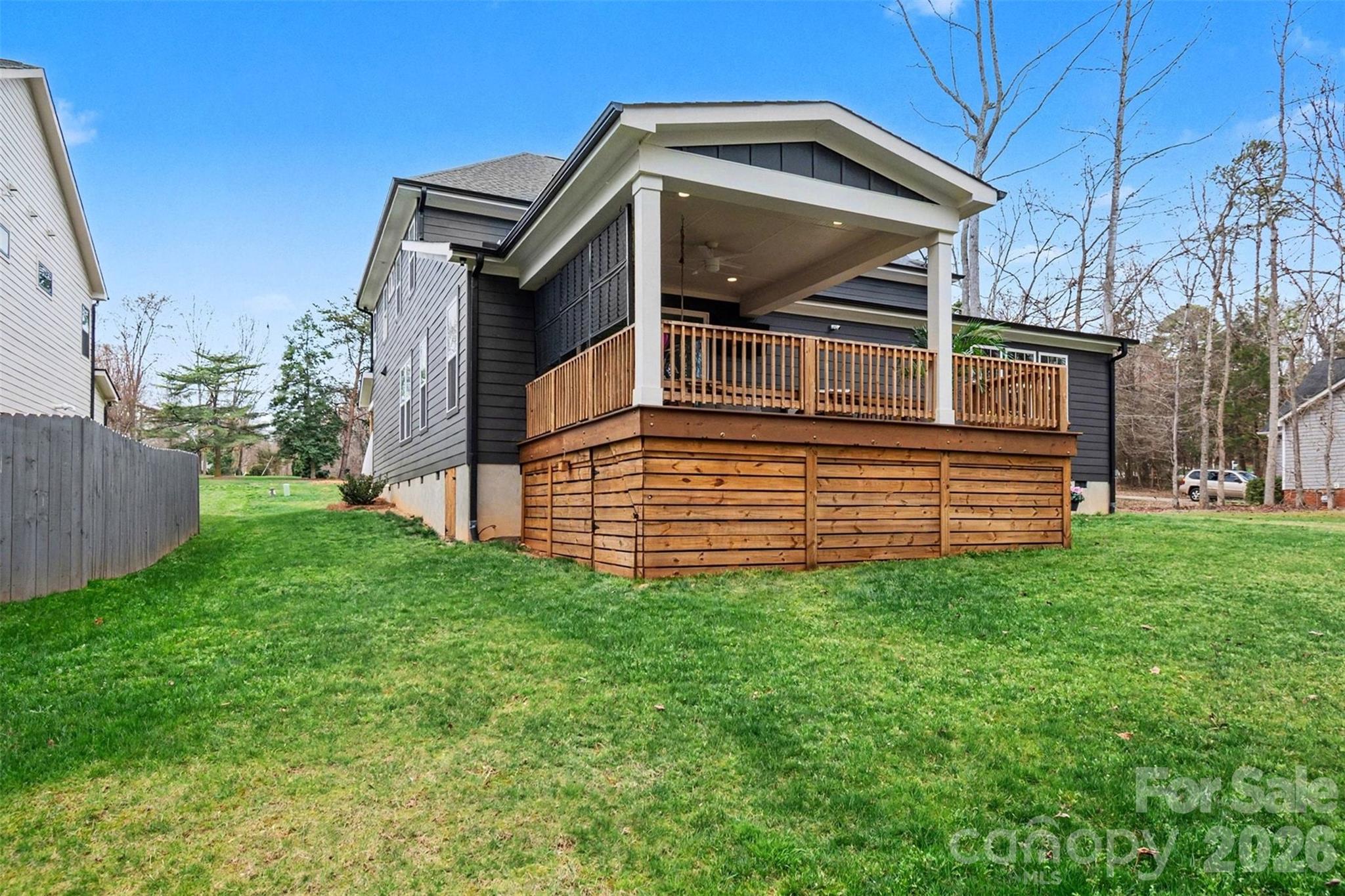 4125 Spring Street Charlotte, NC 28270 - Photo 24 of 37 a view of a house with a small yard
