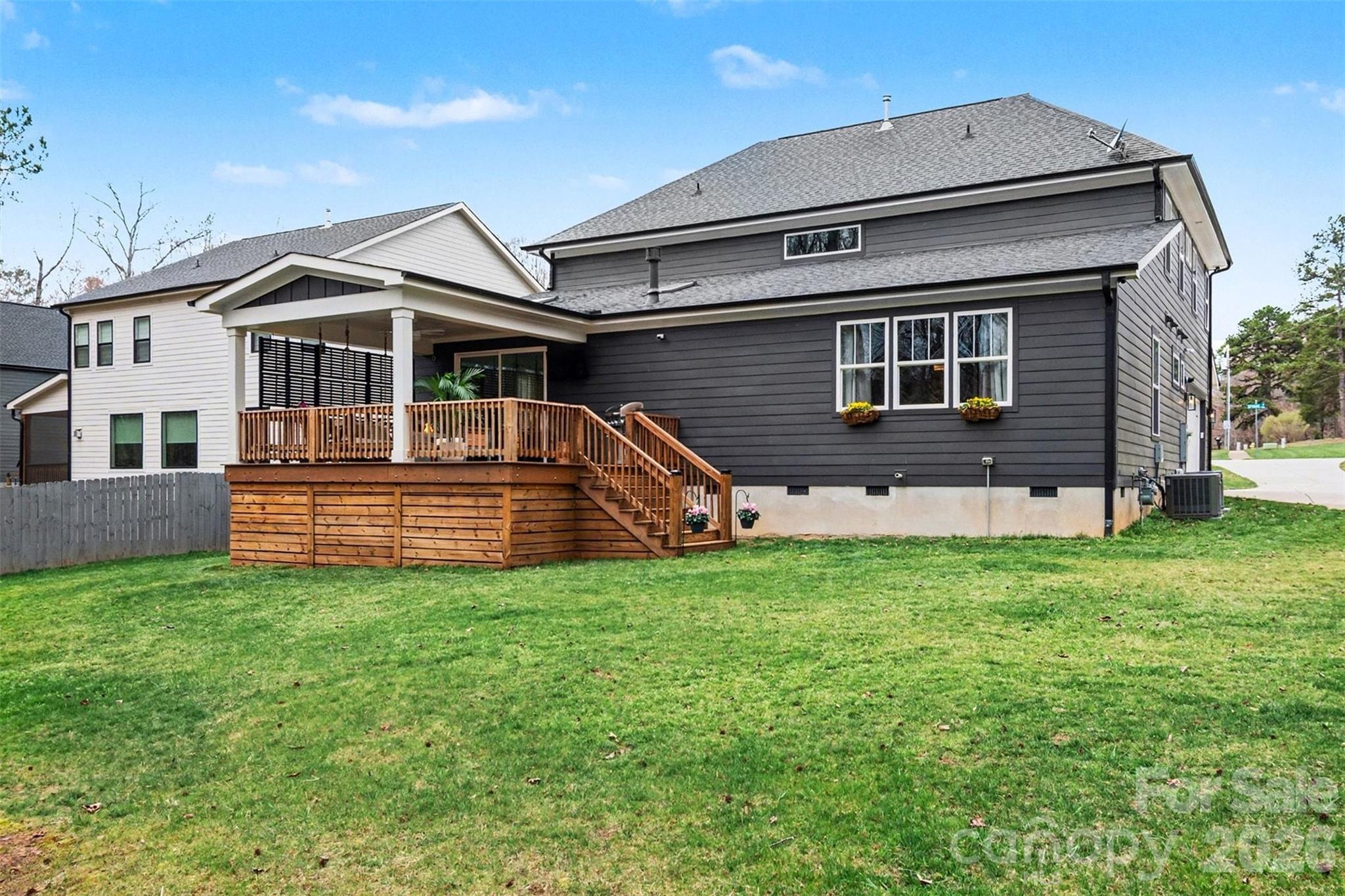 4125 Spring Street Charlotte, NC 28270 - Photo 25 of 37 a front view of a house with a yard