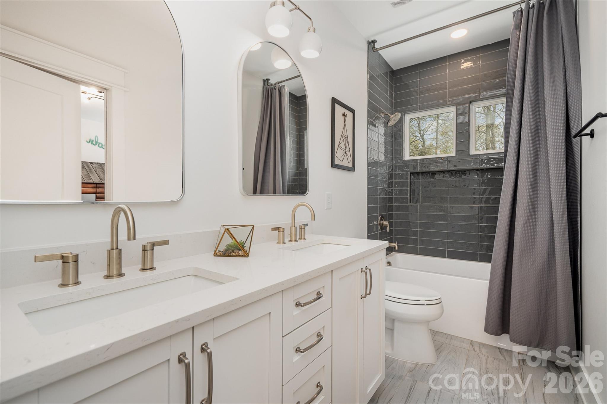 4125 Spring Street Charlotte, NC 28270 - Photo 30 of 37 a bathroom with a sink a toilet and shower