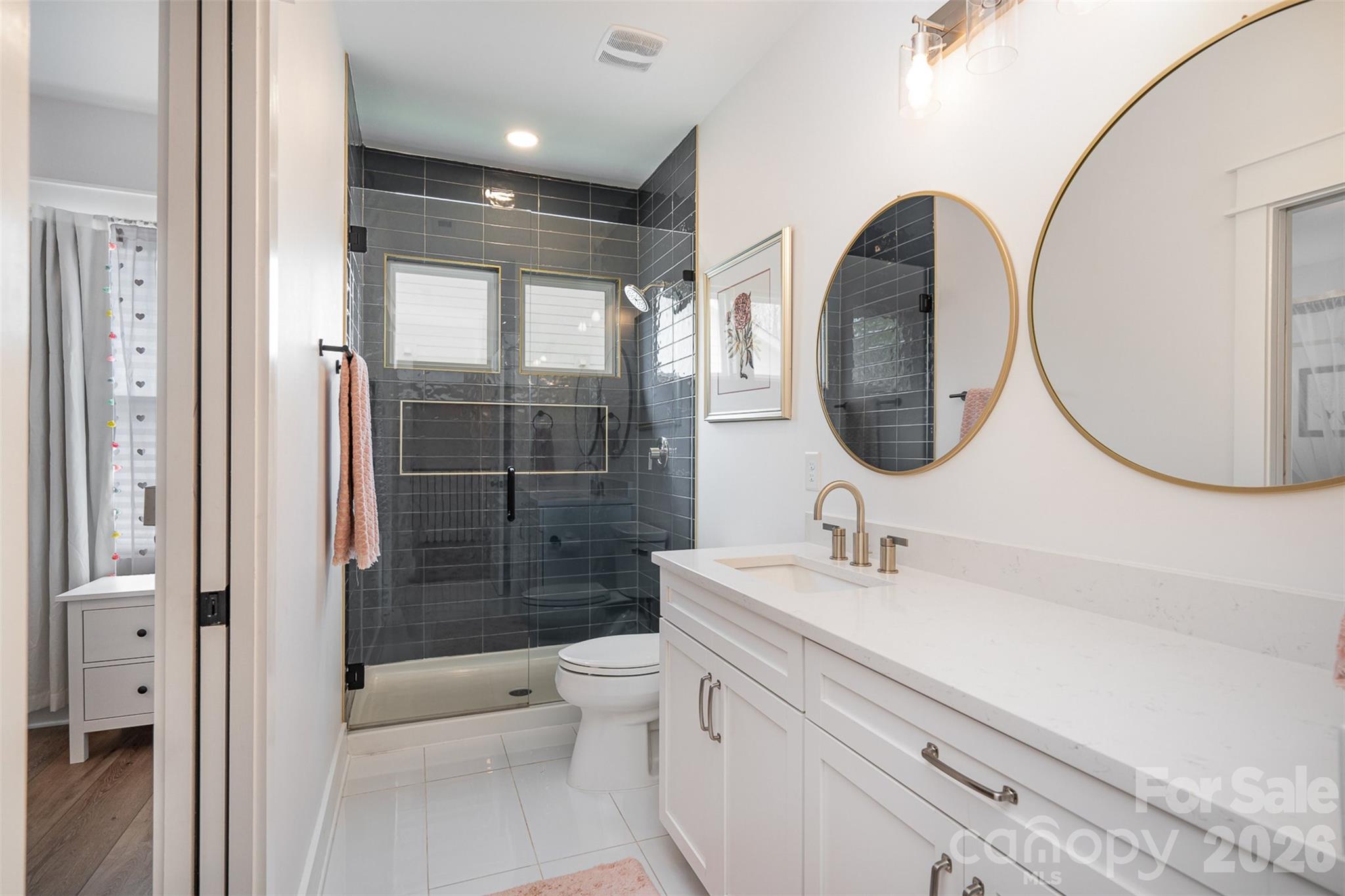 4125 Spring Street Charlotte, NC 28270 - Photo 34 of 37 a bathroom with a sink a toilet and shower