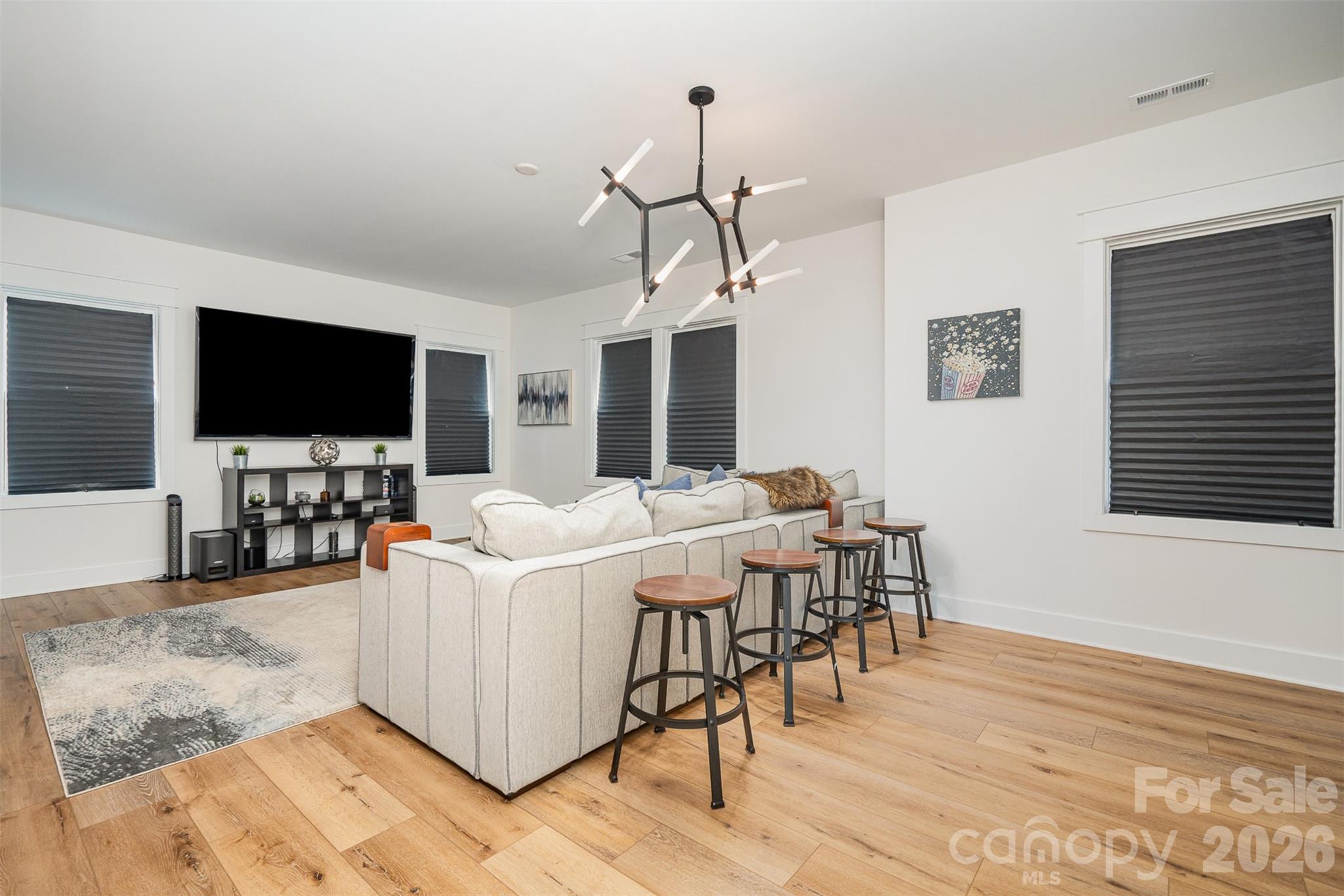 4125 Spring Street Charlotte, NC 28270 - Photo 35 of 37 a living room with furniture and a flat screen tv