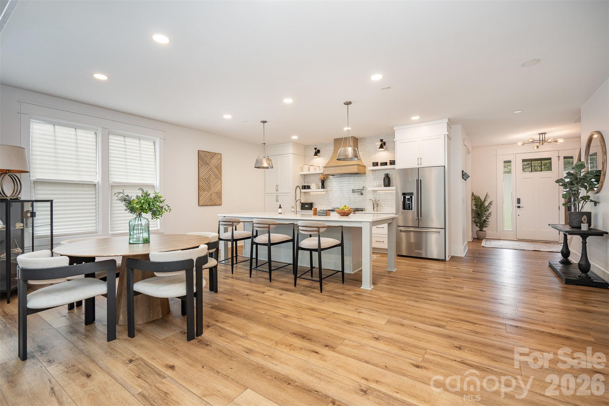 4125 Spring Street Charlotte, NC 28270 - Photo 8 of 37 a view of a kitchen with dining room and wooden floor