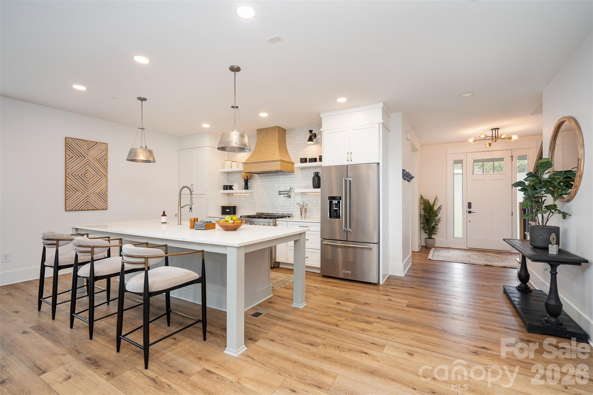 4125 Spring Street Charlotte, NC 28270 - Photo 9 of 37 a kitchen that has a table chairs refrigerator and wooden floor