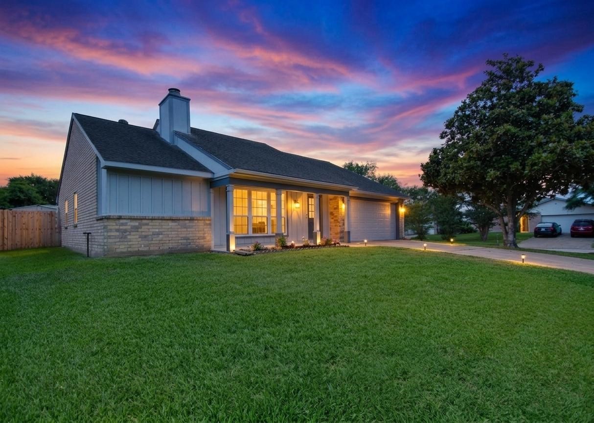 22831 John Rolfe Lane Katy, TX 77449 - Photo 4 of 34 a front view of a house with a garden