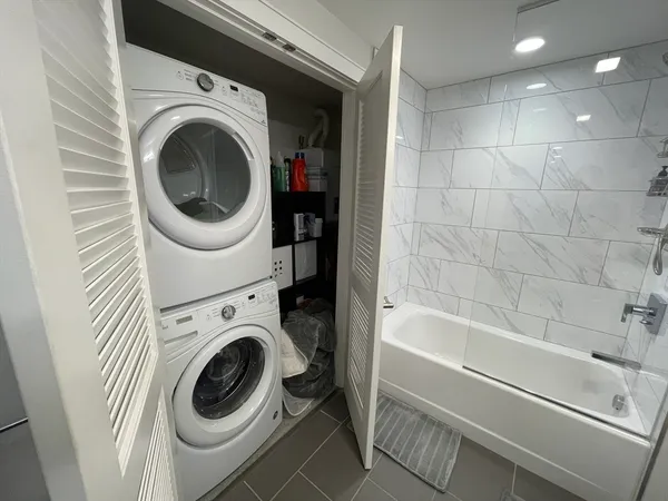 a utility room with dryer and washer