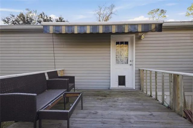 a view of a house with a yard and garden