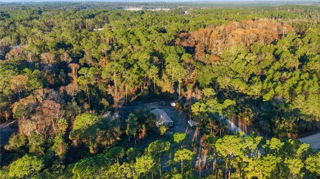 a living room with fireplace furniture and a fireplace