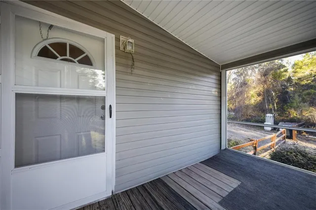 a living room with furniture ceiling fan and a fireplace