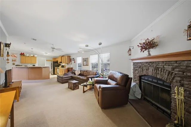 a large kitchen with stainless steel appliances granite countertop a sink refrigerator and cabinets