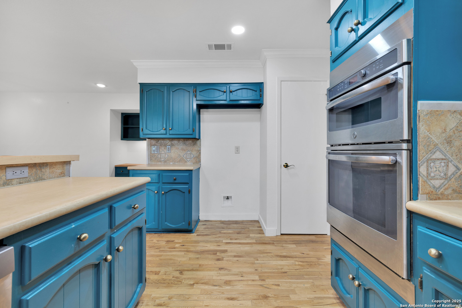 11361 Moonsail Helotes, TX 78023 - Photo 13 of 27 a kitchen with stainless steel appliances granite countertop a refrigerator and a stove top oven