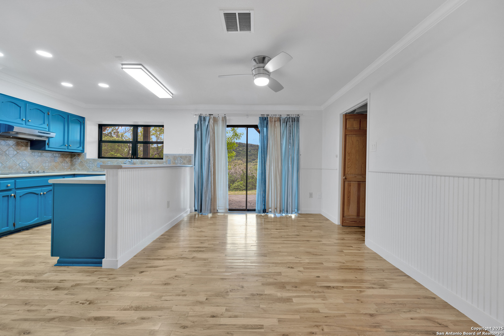 11361 Moonsail Helotes, TX 78023 - Photo 14 of 27 a view of a kitchen with a sink and a refrigerator