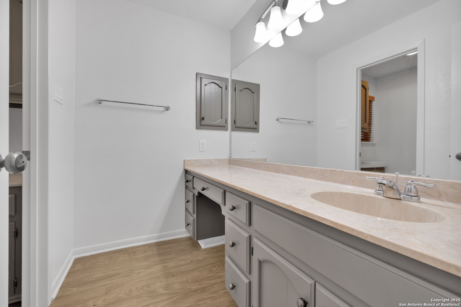 11361 Moonsail Helotes, TX 78023 - Photo 19 of 27 a bathroom with a sink and a mirror