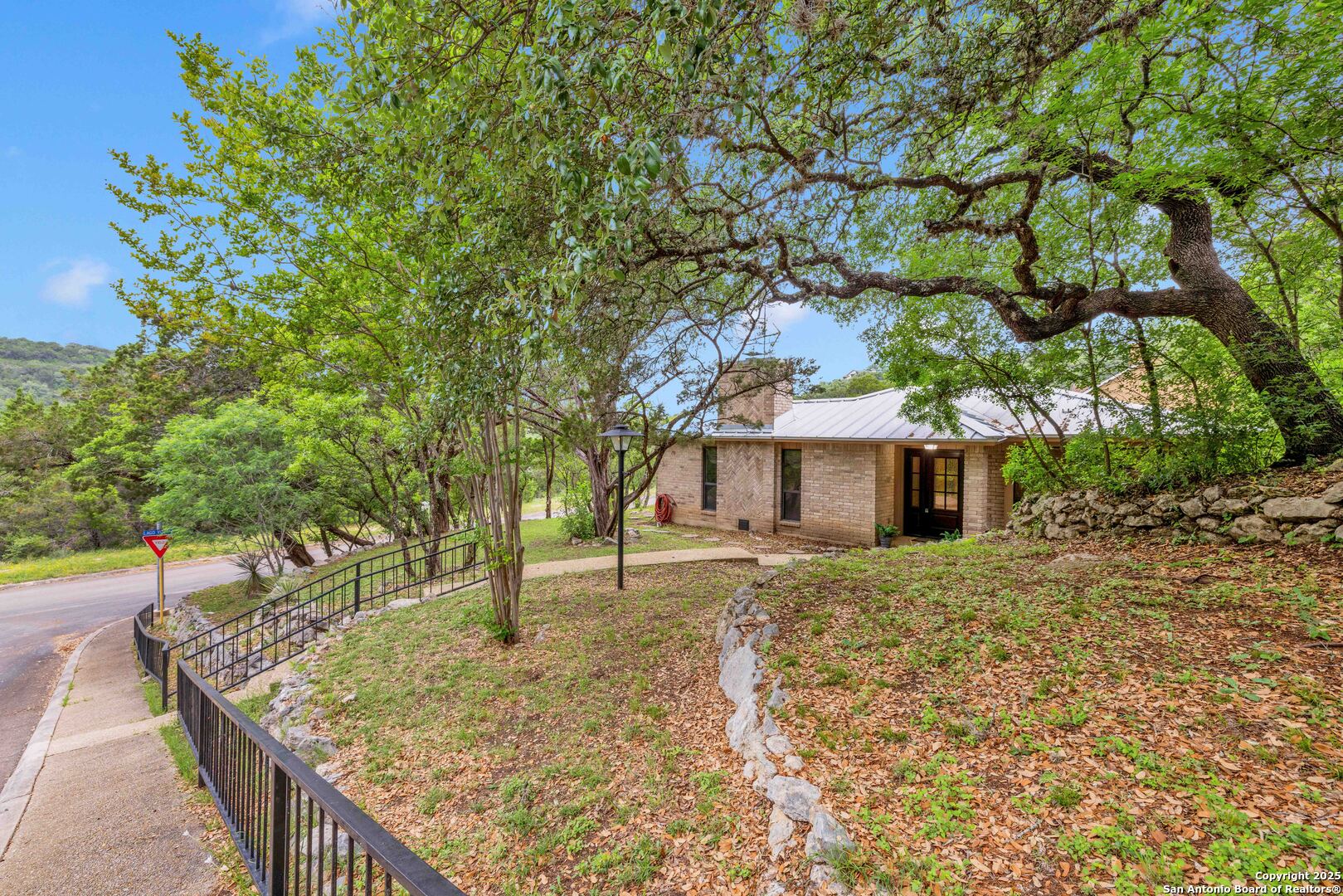 11361 Moonsail Helotes, TX 78023 - Photo 2 of 27 a view of a house with a tree