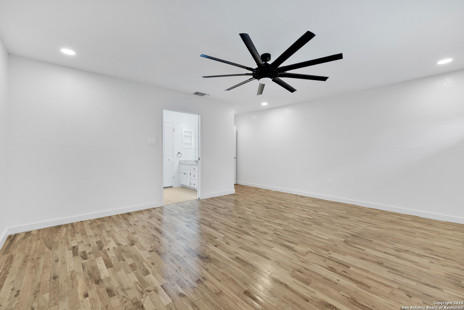 11361 Moonsail Helotes, TX 78023 - Photo 21 of 27 wooden floor in an empty room