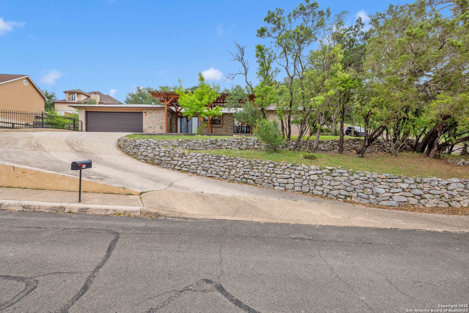 11361 Moonsail Helotes, TX 78023 - Photo 4 of 27 a front view of a house with a yard