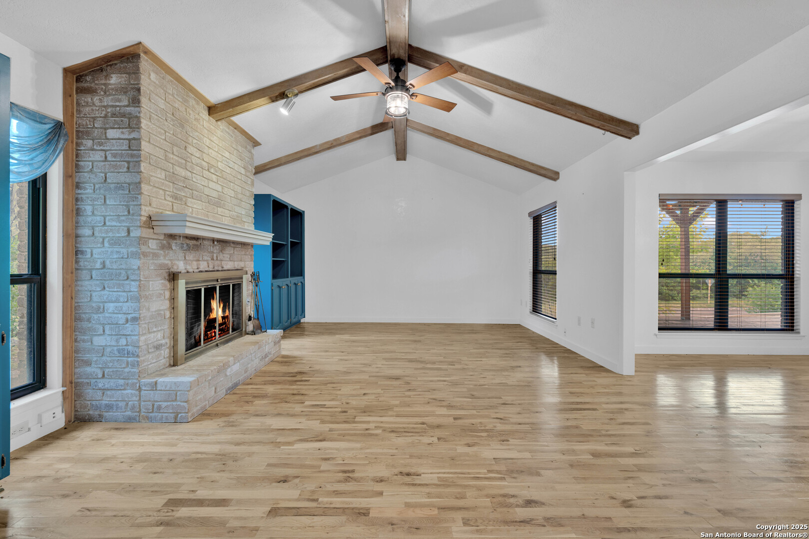11361 Moonsail Helotes, TX 78023 - Photo 6 of 27 a view of an empty room with window and fireplace