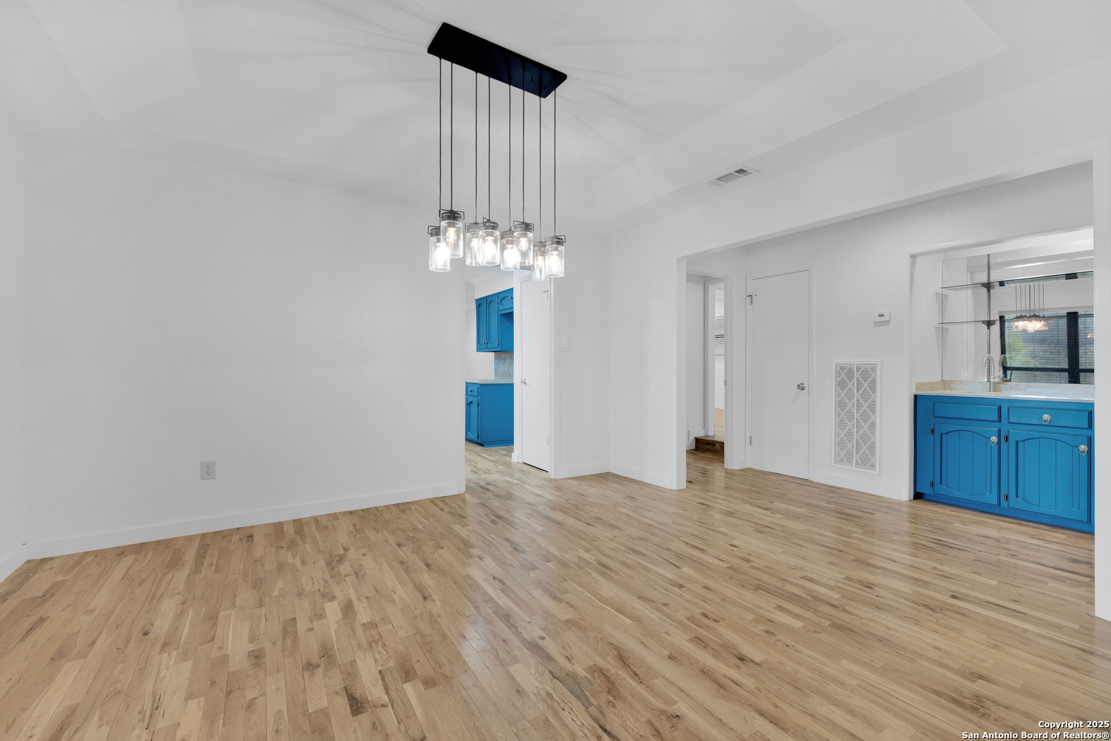 11361 Moonsail Helotes, TX 78023 - Photo 9 of 27 a view of a kitchen with cabinet and a hallway