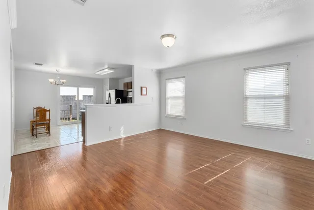 a view of a livingroom with furniture and wooden floor