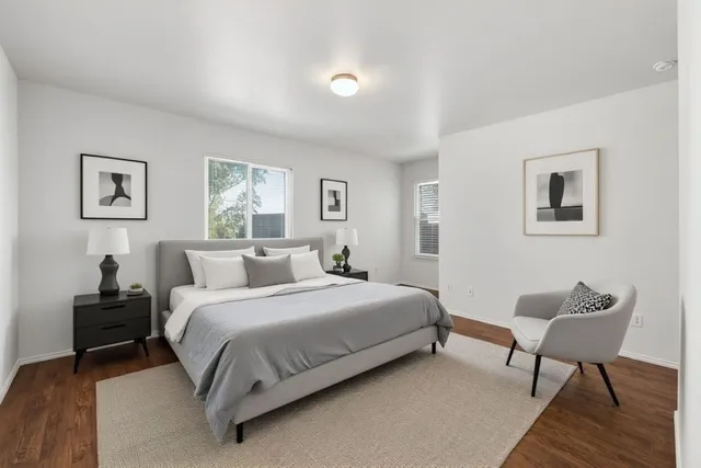 a bedroom with a bed and a couch