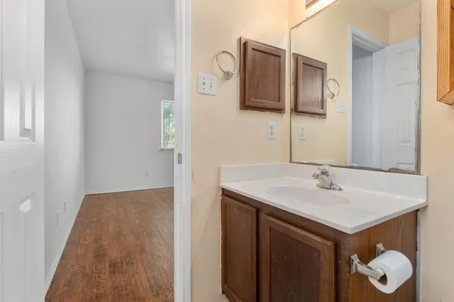 a bathroom with a sink and a mirror