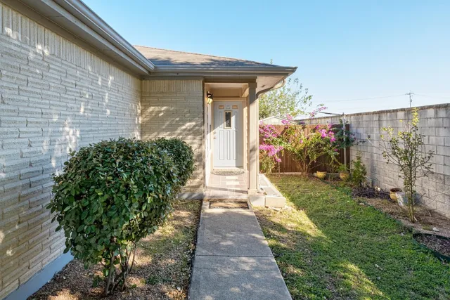 a view of a pathway with a house in the background