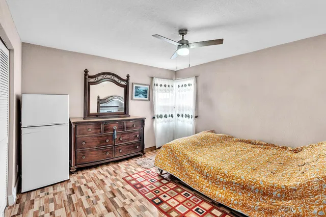 a bedroom with a bed and a dresser