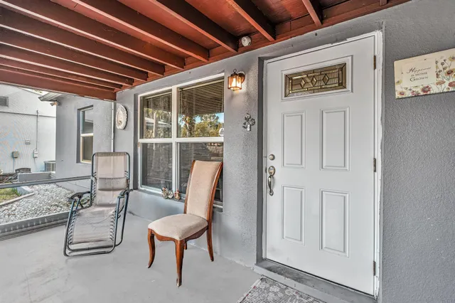 a view of a hallway with seating area