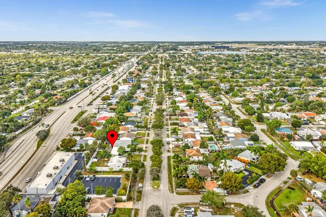 an aerial view of residential houses with ocean view