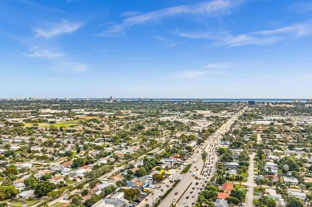 an aerial view of residential houses with city view