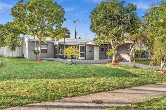 front view of a house with a yard