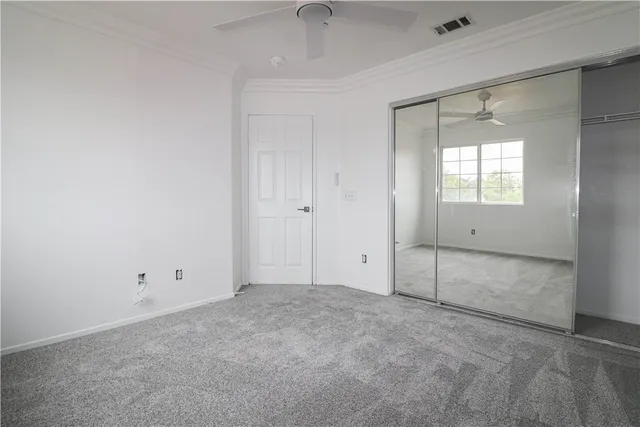 an empty room with closet area