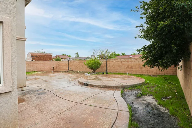 a view of a white house with large windows