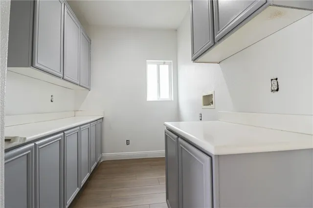 a kitchen with kitchen island granite countertop a sink stove and refrigerator