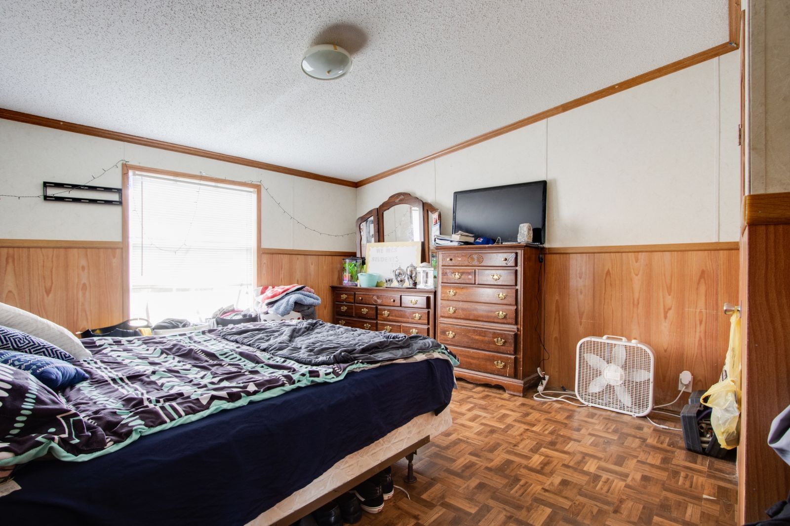 674 Walnut Hill Road Lebanon, TN 37090 - Photo 14 of 19 a bedroom with a bed and dresser with mirror