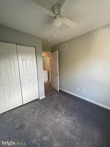 an empty room with a empty space and windows