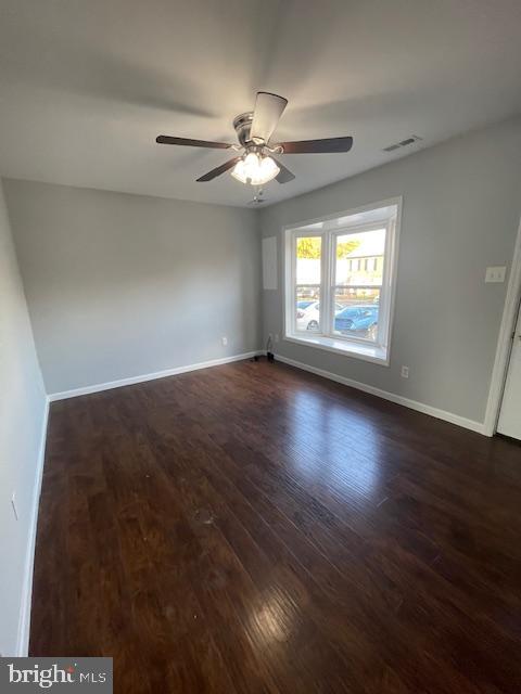 403 Strathaven Court Newark, DE 19702 - Photo 2 of 23 an empty room with wooden floor chandelier fan and windows