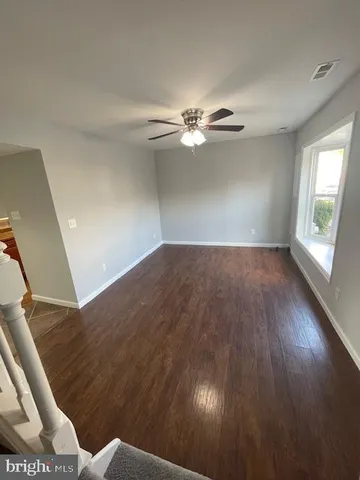 a view of an empty room with glass door