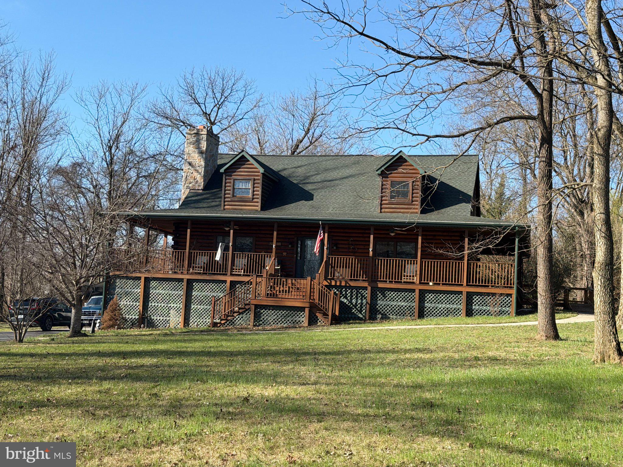 1125 Clifton Road Berryville, VA 22611 - Photo 1 of 1 Charming log cabin nestled in nature.