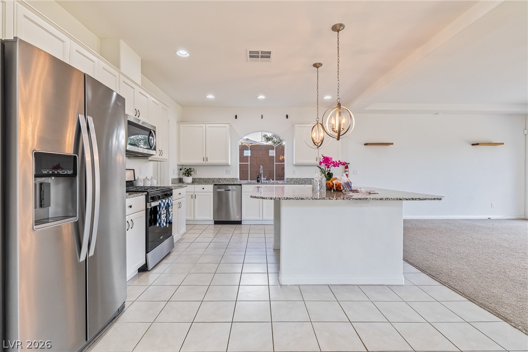 5510 Ripple Ridge Avenue Las Vegas, NV 89139 - Photo 22 of 45 This bright kitchen features ample counter space, making it perfect for both cooking and entertaining.