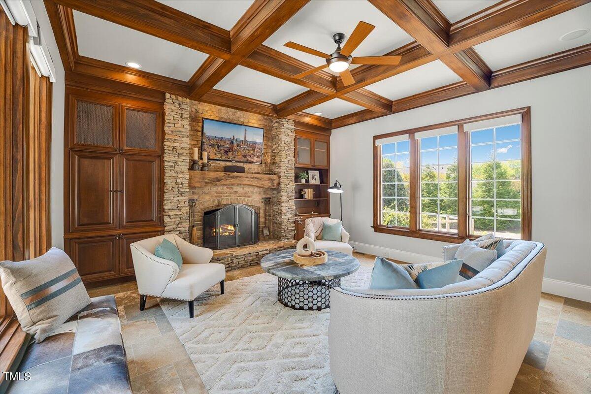 2909 Spaldwick Court Raleigh, NC 27613 - Photo 39 of 86 a living room with furniture and a fireplace