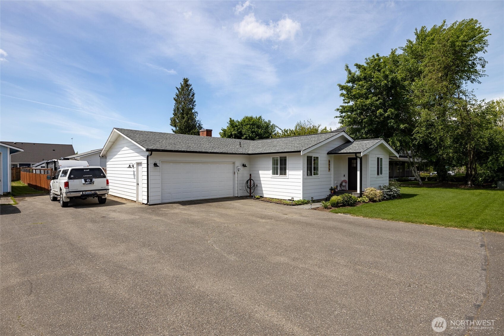 8679 Depot Road Lynden, WA 98264 - Photo 2 of 40 a view of a house with a yard and garage