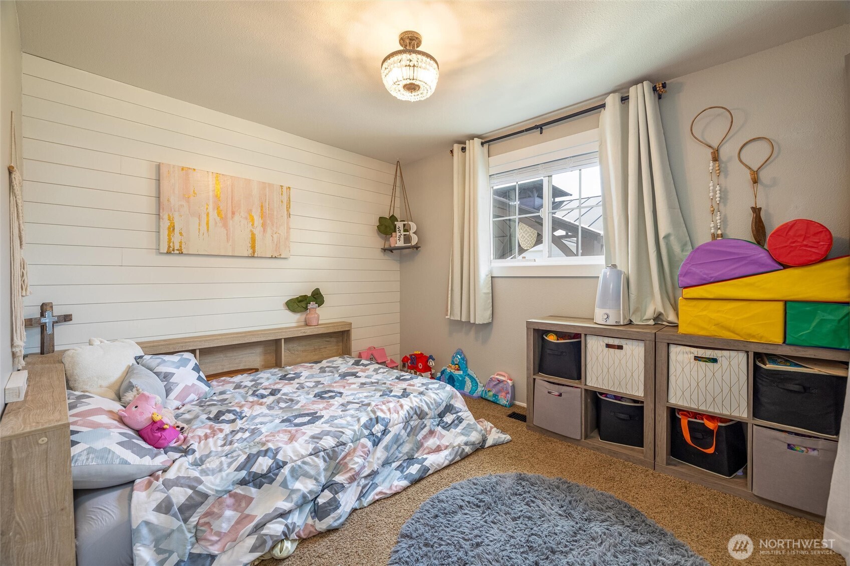 8679 Depot Road Lynden, WA 98264 - Photo 23 of 40 a bed sitting in a bedroom next to a window