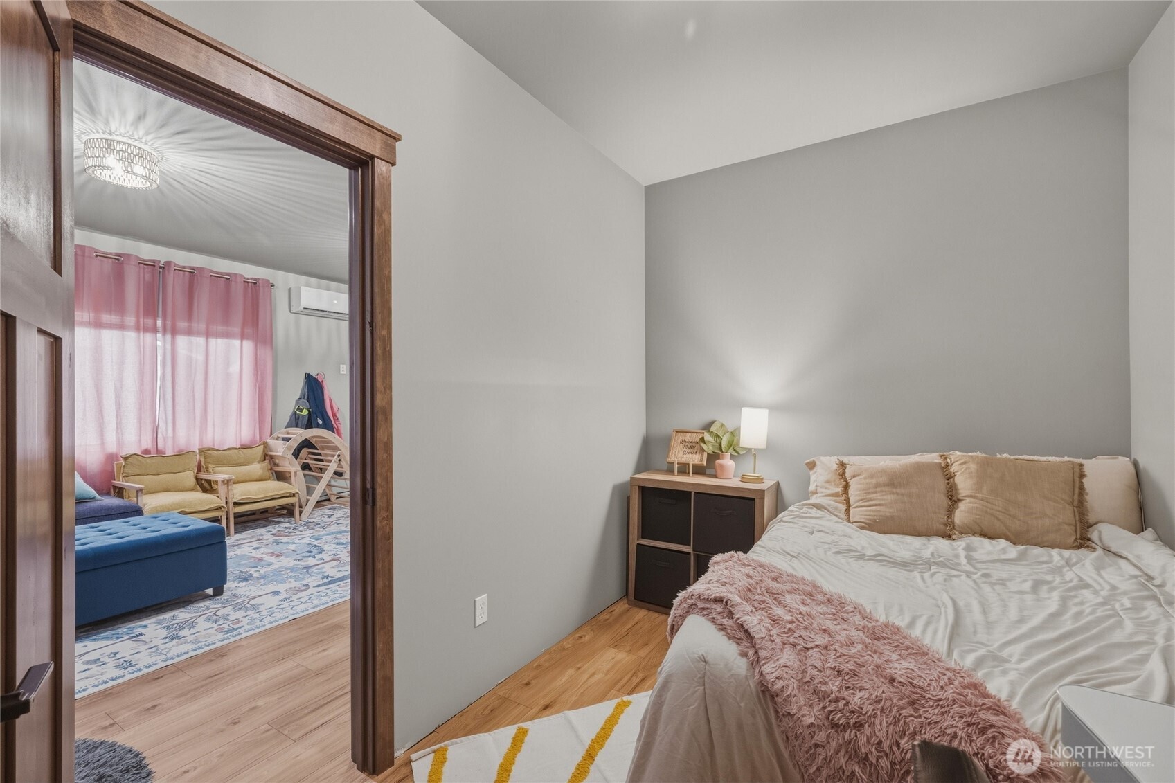 8679 Depot Road Lynden, WA 98264 - Photo 33 of 40 a bedroom with a bed and a mirror on dresser