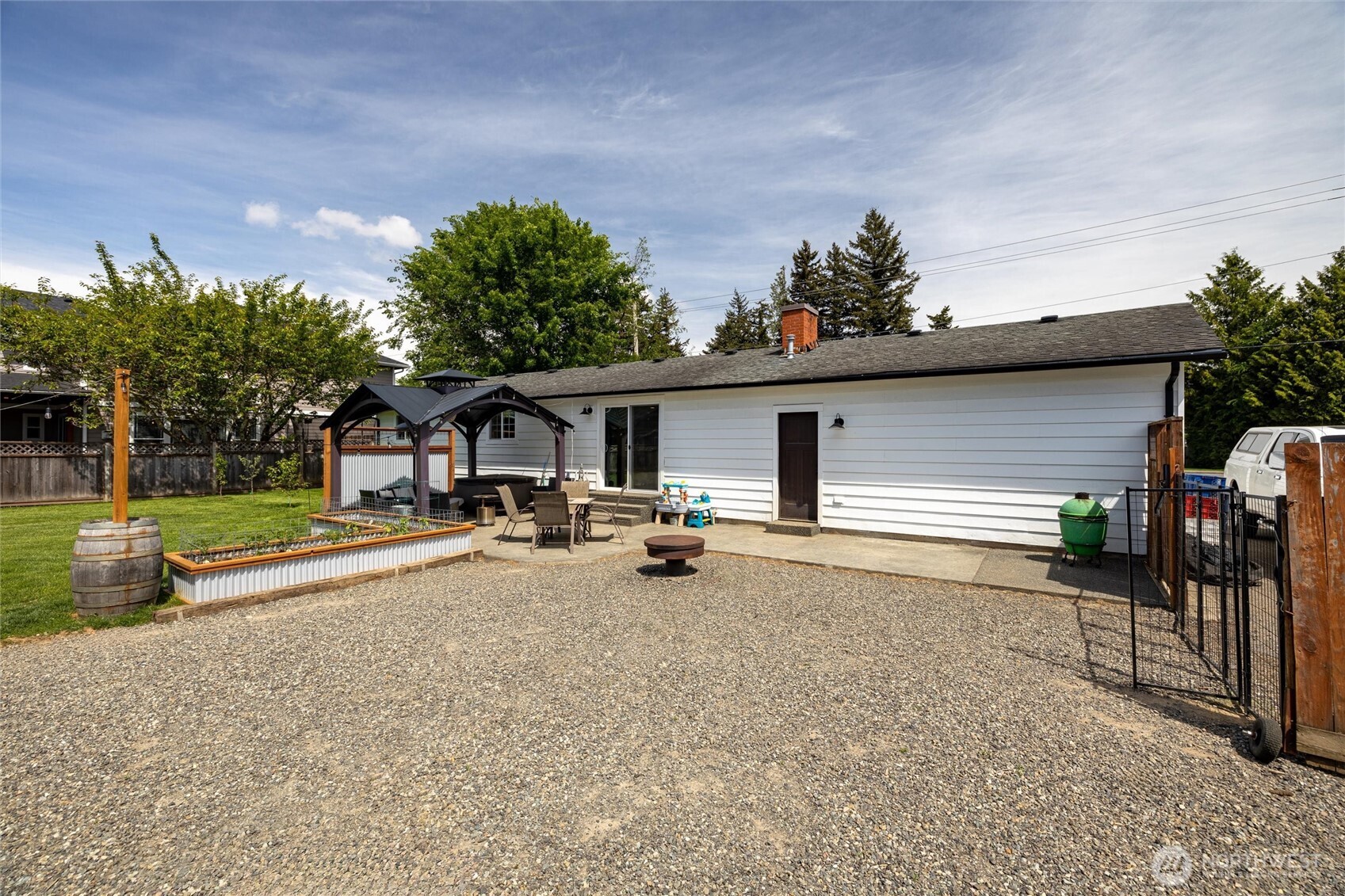 8679 Depot Road Lynden, WA 98264 - Photo 35 of 40 a view of a house with backyard and sitting area