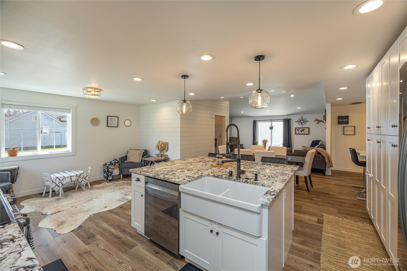 8679 Depot Road Lynden, WA 98264 - Photo 6 of 40 a view of a kitchen with kitchen island stainless steel appliances a sink and living room view